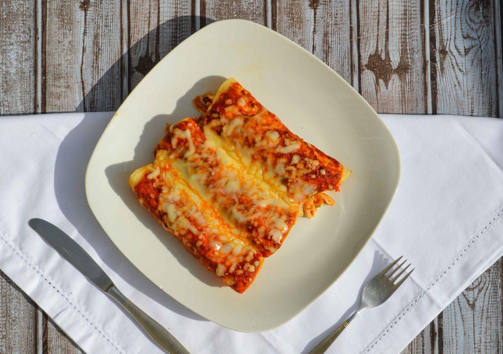 Enchilada · Soft corn tortilla stuffed with ground beef or chicken, topped with our special enchilada sauce.