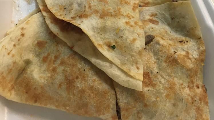 Steak Quesadilla · Served with Guacamole, Pico, Refried Beans, Sour Cream, & Shredded Cheese.