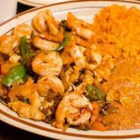 Shrimp Fajita · Served with Guacamole, Sour Cream, Pico de Gallo, Lettuce, Rice, Refried Beans, and a side o...