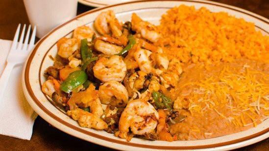 Shrimp Fajita · Served with Guacamole, Sour Cream, Pico de Gallo, Lettuce, Rice, Refried Beans, and a side of tortillas.