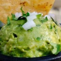Guacamole · A traditional guacamole dip made with avocados, lime, cilantro, white onions, serrano chile,...