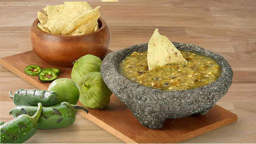 Roasted Tomatillo Salsa · Medium-high heat, tangy and fresh dip made with tomatillos, avocados, serrano chiles, and cilantro.  (pictured top)
Vegan
Gluten-free