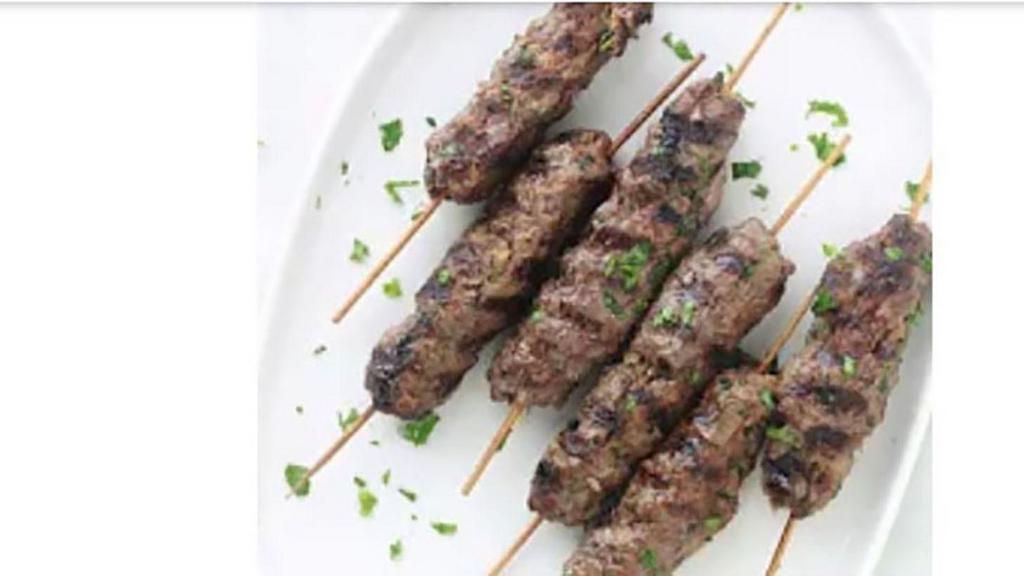 Kefta Plate · Ground lamb and beef skewered and grilled, served over rice with two sides.