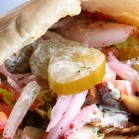 Chicken Shawarma Pita · Stuffed with lettuce, tomato, onion, pickle, shredded chicken breast and thigh marinated ove...