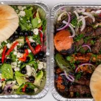 Family Platter · Two chicken, three beef or lamb, four kefta, six pita, . Served over rice with two sides and...