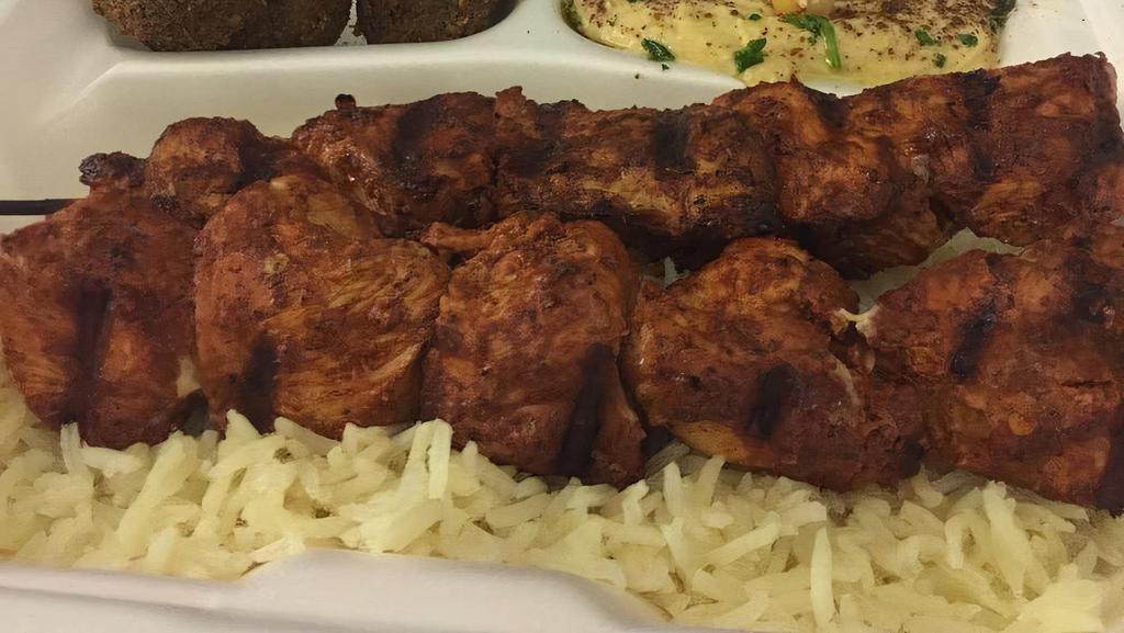 Kefta Kabob Platter · Four skewers of ground lamb and beef. Served over rice with pita and any two sides.