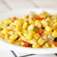 Corn Salad · Corn, diced peppers, cucumbers, and touch of oil and vinegar.