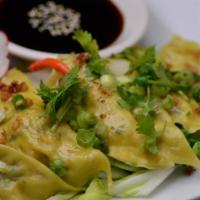 #12 Pot Sticker. · A Thai house appetizer favorite. Steamed delicious dumplings stuffed with spinach and chicke...