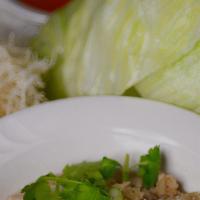 #11 Thai House Mee Krob. · Crispy rice noodles. Served with sauteed chopped chicken, onion, garlic, fresh lettuce, and ...