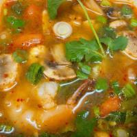 #14 Tom Yum. · Thai House famous slightly sour and spicy soup made with mushroom, tomato, lemongrass, and l...