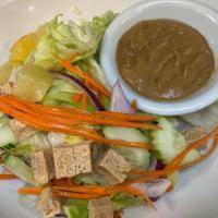 #20 Thai House Salad. · Fresh bean sprout, carrot, lettuce, onion, tomato, cucumber, and fried tofu. Served with pea...