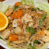 #67 Kai Khua. · Stir-fried rice noodles with your choice of meat, egg, onion, snow pea, and carrot in Thai s...