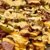 Factory Loaded Fries · Large chili cheese fries with shredded bacon bits, diced beef hot dog, jalapenos, green onio...