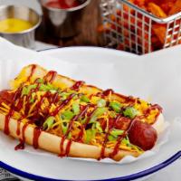 Memphis Dog · Bacon-wrapped beef hot dog topped with shredded cheese, BBQ sauce, and green onions.