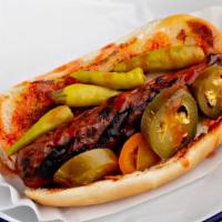 Fire Dog · Beef hot dog topped with Arizona heat hot sauce, jalapeno peppers, and sport peppers.