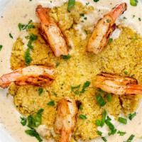 Shrimp & Grits · Stone ground grits covered in Parmesan cream sauce topped with grilled or fried gulf shrimp.