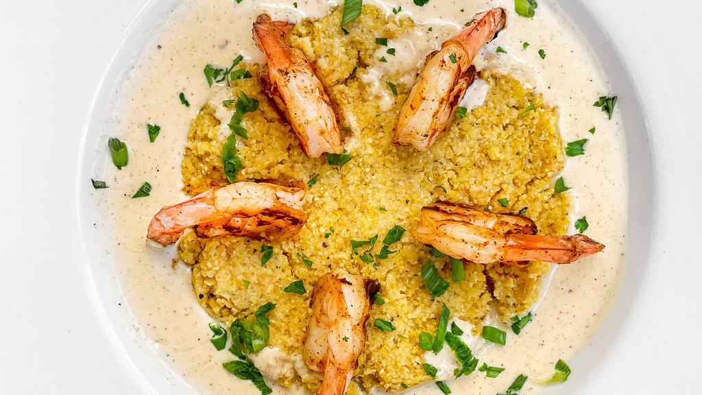 Shrimp & Grits · Stone ground grits covered in Parmesan cream sauce topped with grilled or fried gulf shrimp.