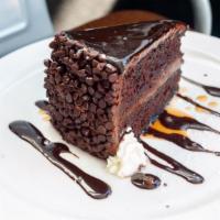 Melanin Magic · Three layers of chocolate cake wit chocolate icing  & caramel drizzle.