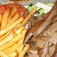 Gyros & Fries · Gyros meat on the top of French fries with Greek salad, pita bread and gyros sauce.