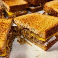Fluffy Vegan Patti Melt · Impossible patty, smothered with sautéed onions and a Caio cheese slice perfectly melted on ...