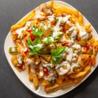 Loaded Veggie Fries  · Golden brown French Fries topped with cheese shreds, peppers,, mushrooms and vegan ranch.