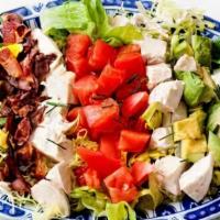 Cobb Salad · Mixed greens with grilled chicken, avocado, diced tomato, crispy bacon bits, blue cheese cru...