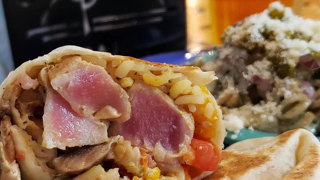 Honey Wasabi Tuna Burrito · Grilled Ahi Tuna wrapped with rice, mushrooms, carrots, celery, onions, peppers, tomato & mixed cheese, finished with our Honey Wasabi Sauce