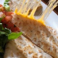 Cheese Quesadilla · A grilled flour tortilla stuffed with sautéed peppers & onions & mixed cheese