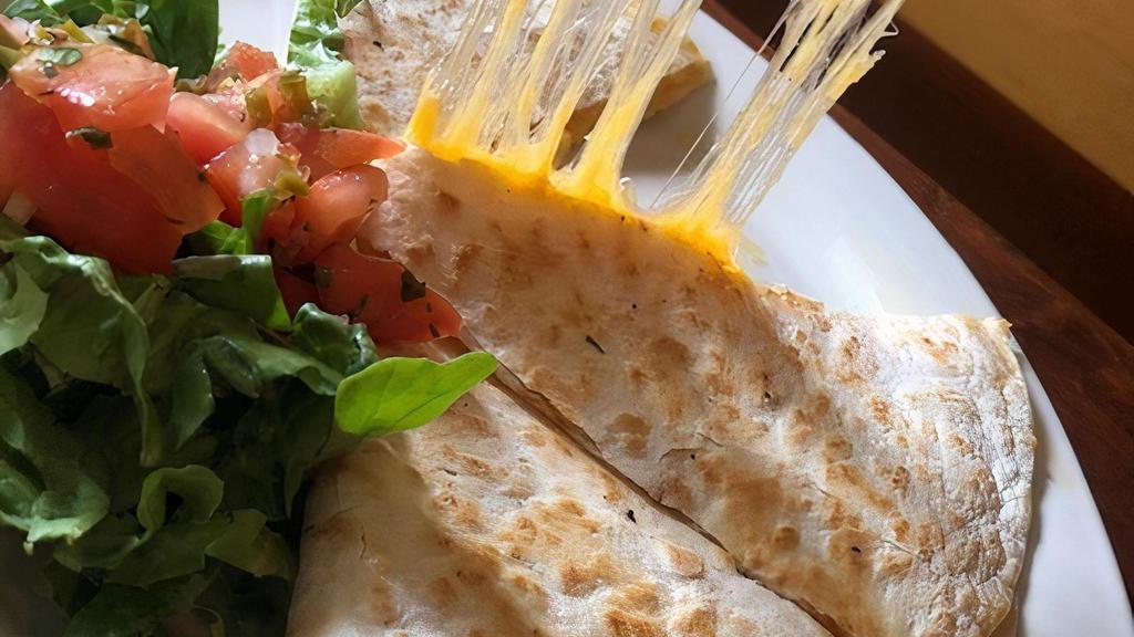 Cheese Quesadilla · A grilled flour tortilla stuffed with sautéed peppers & onions & mixed cheese