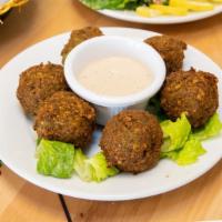 Falafel · Ground chick pea and herb spiced bites [6 pc]. Vegetarian.