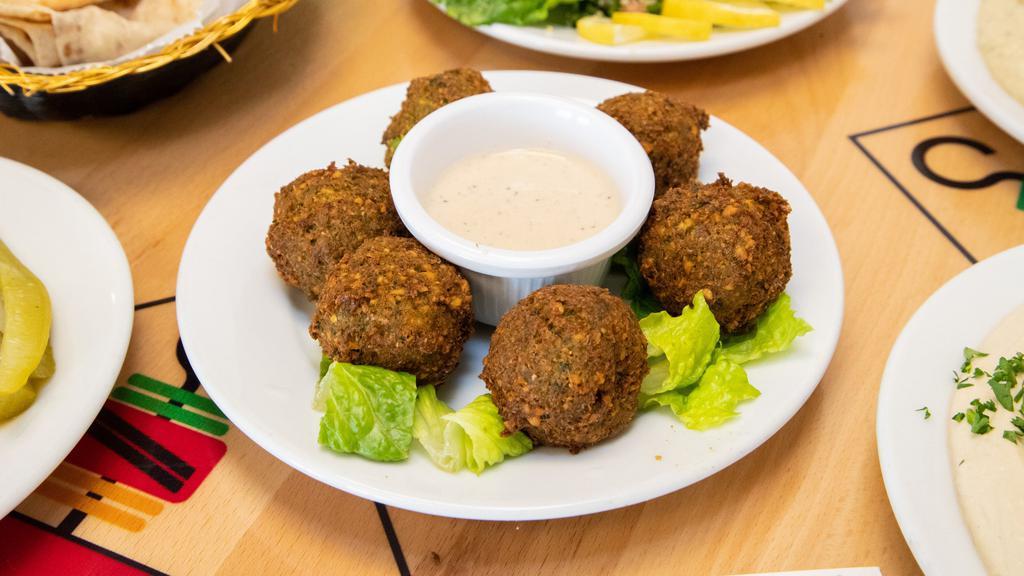 Falafel · Ground chick pea and herb spiced bites [6 pc]. Vegetarian.