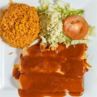 Yolandas · Three chicken enchiladas served with Spanish rice, lettuce, tomato, and sour cream.