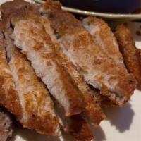 Pork Katsu · Deep fried breaded pork with special sauce.
