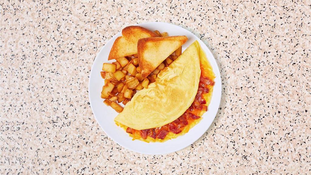 Bacon Cheddar Omelette · Three egg omelette with crispy bacon bits and gooey melted cheddar cheesse, served with buttered toast and your choice of breakfast potatoes.