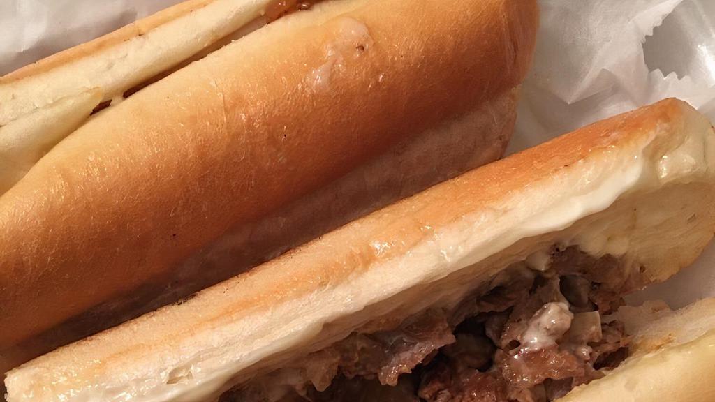 Philly Cheesesteak Sandwich · Grilled onions, green peppers, white American cheese & mayonnaise.