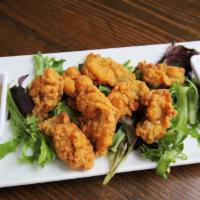 Oyster Fry · Spicy corn meal-dusted oysters, quick-fried golden brown and served with our white remoulade...