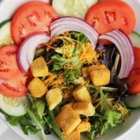 House Salad · Fresh greens served with tomatoes, cucumbers, onions, shredded cheese, mushrooms and crouton...