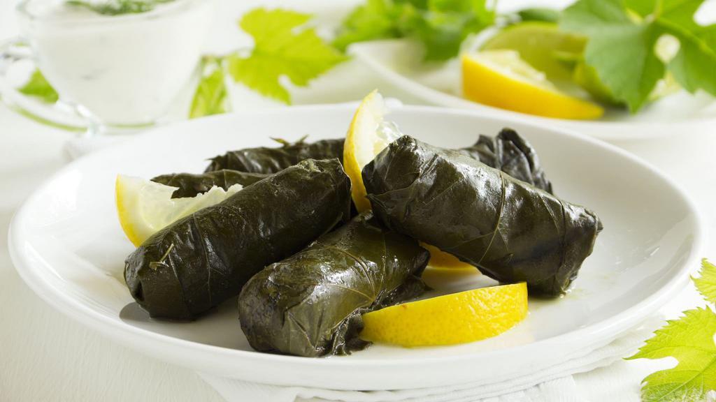 Grape Leaves (Dolmades) · (6.pcs) Rolled grape leaves stuffed with seasoned rice and grilled onions served with one side of taziki souse