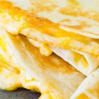 Flames Pita Quesadilla · Pita bread filled with your choice of meat: chicken, lamb & beef, and gyro.grilled peppers, ...