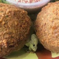 Spicy Stuffed Falafel · (6.Pcs)  Fried balls of Chickpeas and herbs filled with Flames specialty  spicy mix