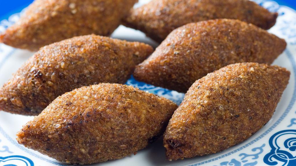 Fried Kibbeh (2.Pcs) · Finley paste of a bulgur and lamp filled with ground beef formed into balls and fried
