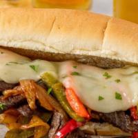 Philly Cheesesteak · Grilled thin cuts of beef, green peppers, onion, and melted Swiss cheese