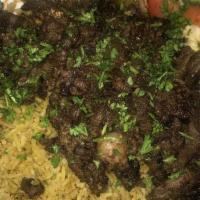 Lamb & Beef Shawarma Plate · served on bed w rice side salad pita bread and taziki
