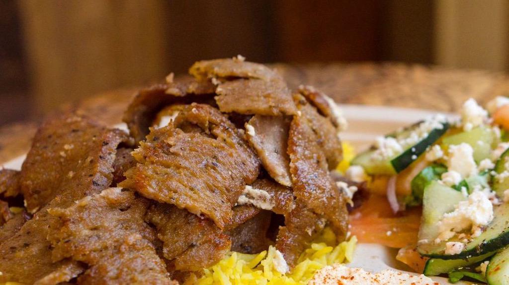Gyros Plate · Grilled slices of a special minced Greek ground beef & lamb from the spinner.