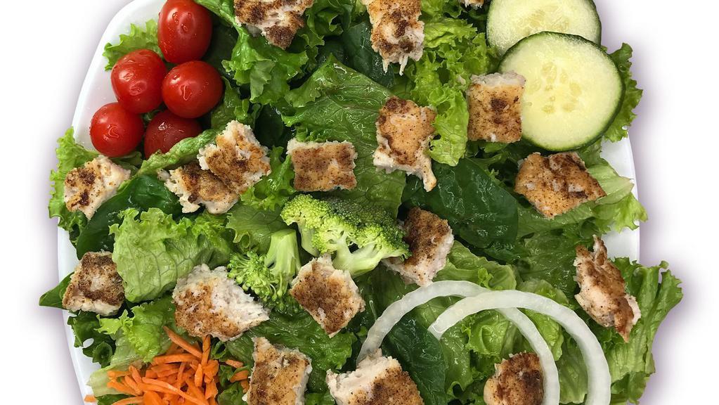 Chicken Salad · Fresh greens, cherry tomatoes, matchstick carrots, cucumbers, croutons, and onions topped with juicy chicken and your choice of dressing.