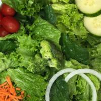 Garden Salad · Fresh greens, cherry tomatoes, matchstick carrots, cucumbers, and onions with your choice of...