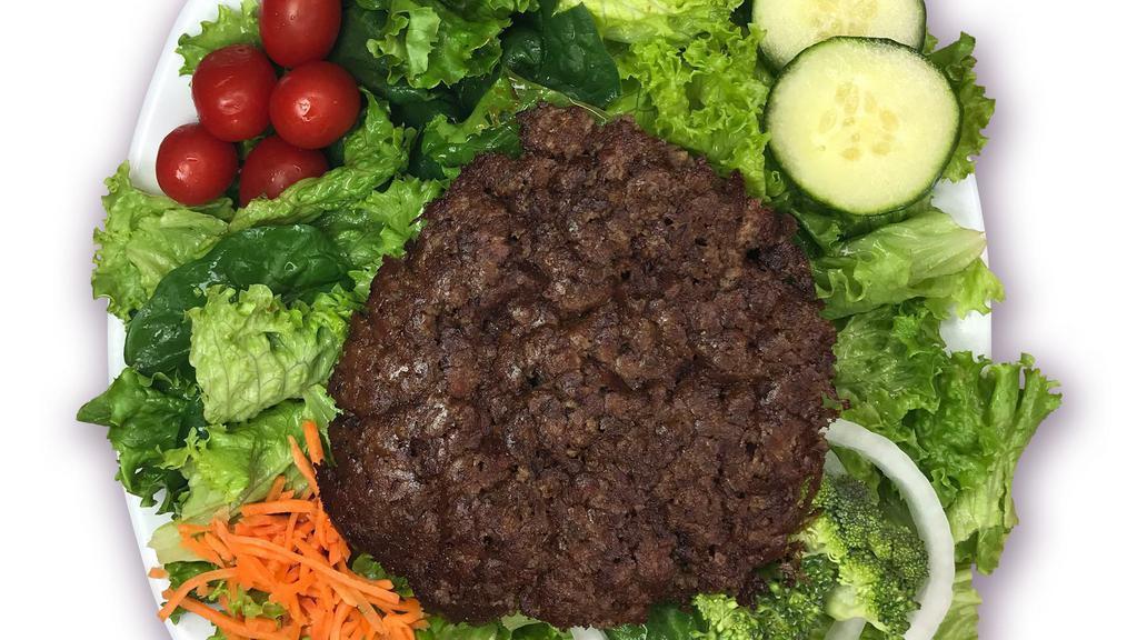 Hamburger Salad · Fresh greens, cherry tomatoes, matchstick carrots, cucumbers, and onions topped with a juicy hamburger steak and your choice of dressing.