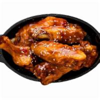 Bone-In Wings · Classic bone-in wings oven-baked, cooked to order perfectly crisp, tossed with your choice o...
