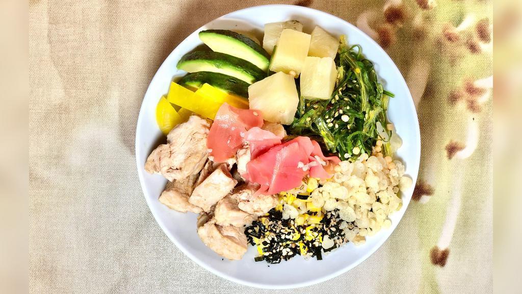 Hei Hei Bowl · Grilled chicken in umami shoyu sauce, pineapple, avocado, corn, takuan, seaweed salad, tempura crunchies, furikake and sushi ginger.