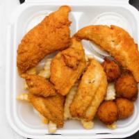 Whiting Fish Box · Served with slaw hush puppies tartar sauce and fries.